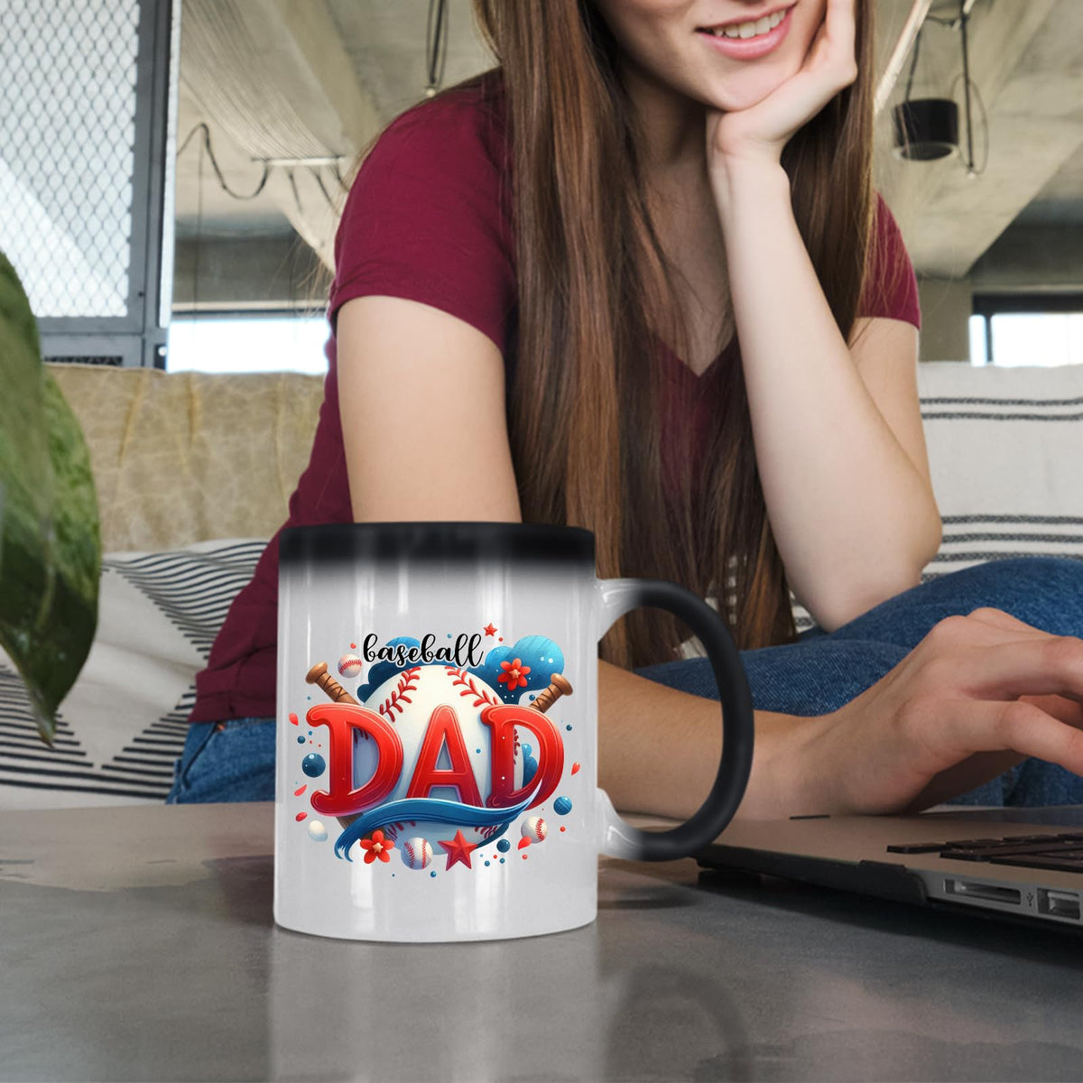 Woman at a laptop with the Baseball Dad colour changing mug