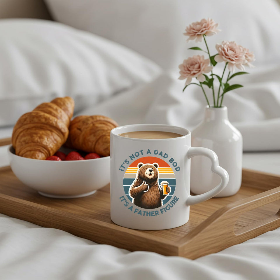 Dad Bod bear heart-handle mug on a breakfast tray with croissants and flowers