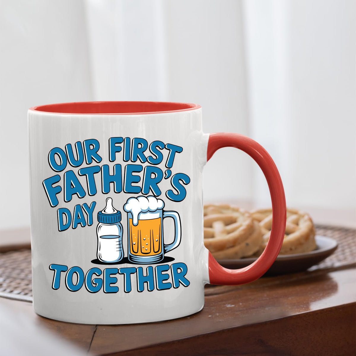 First Father’s Day bottle and beer mug with a red handle beside biscuits