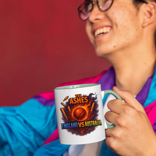 Smiling man holding the Ashes colour handle mug