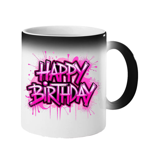 Colour changing mug revealing “Happy Birthday” in bold pink graffiti letters with dripping paint
