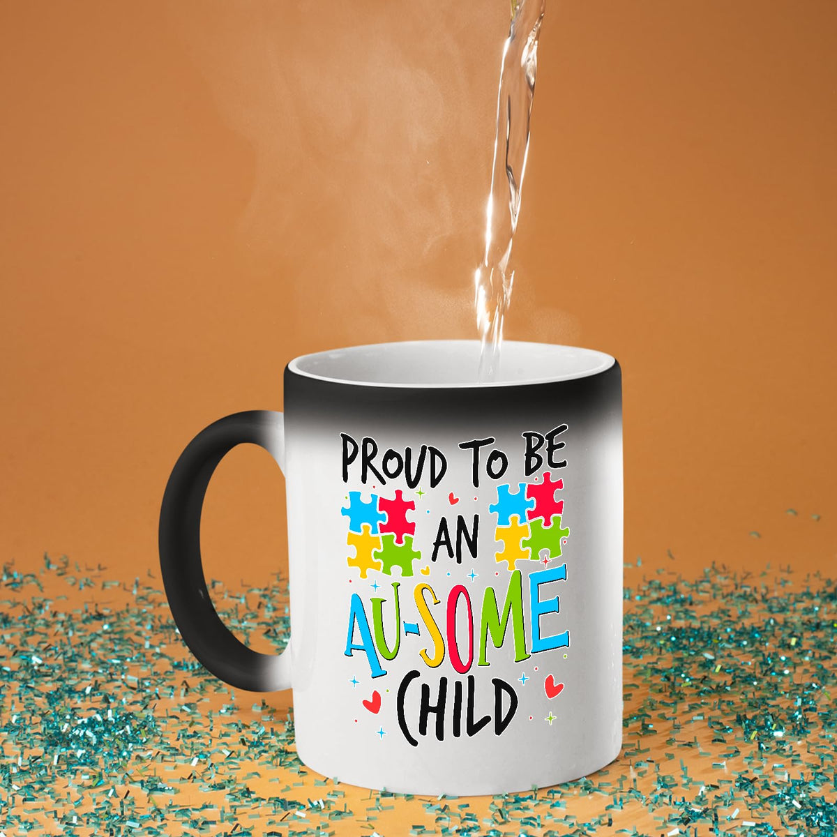 Hot water poured into the Proud to Be an Au-Some Child colour changing mug as the design appears