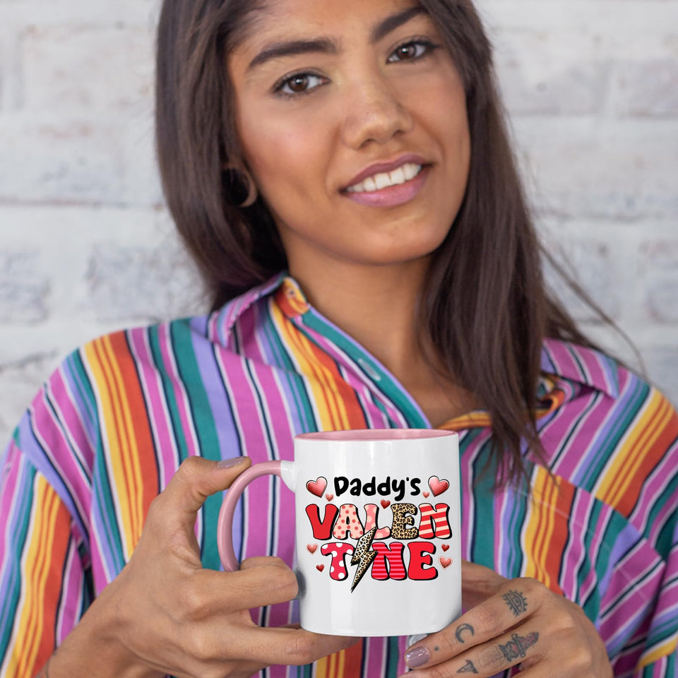 Woman in a striped shirt holding the Daddy’s Valentine colour handle mug