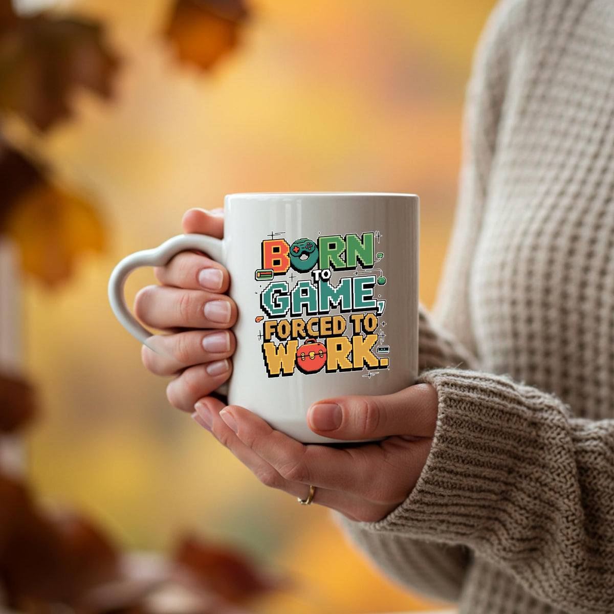 Hands holding the Born to Game heart-handle mug
