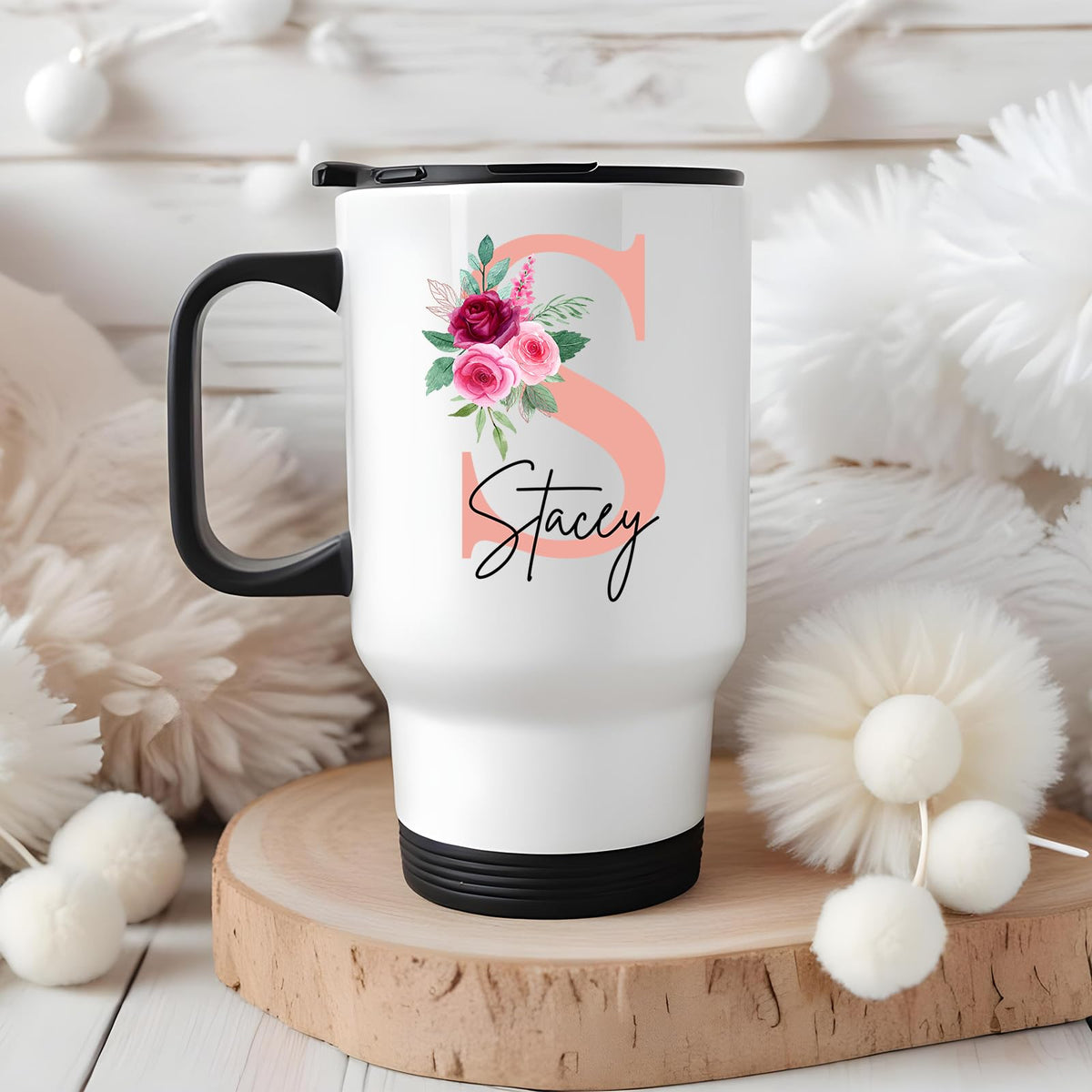 Travel mug with a blush pink initial with roses and an example name in a cosy winter setting
