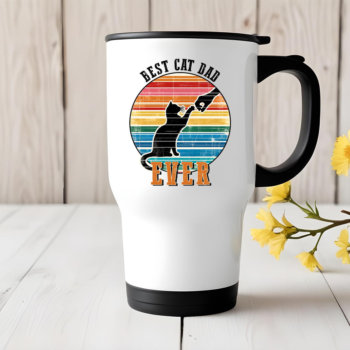 Best Cat Dad Ever travel mug on a white wooden table with yellow flowers