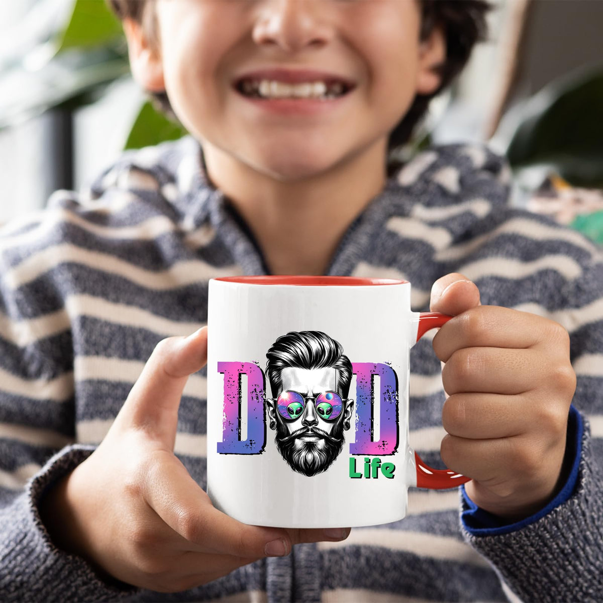 Smiling child holding the Dad Life bearded dad mug with a red handle