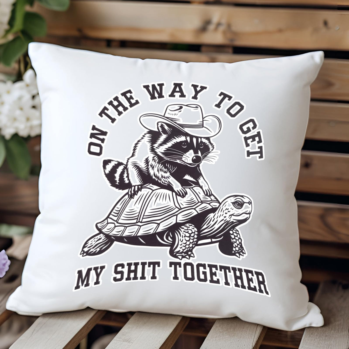 raccoon and tortoise cushion on a wooden bench