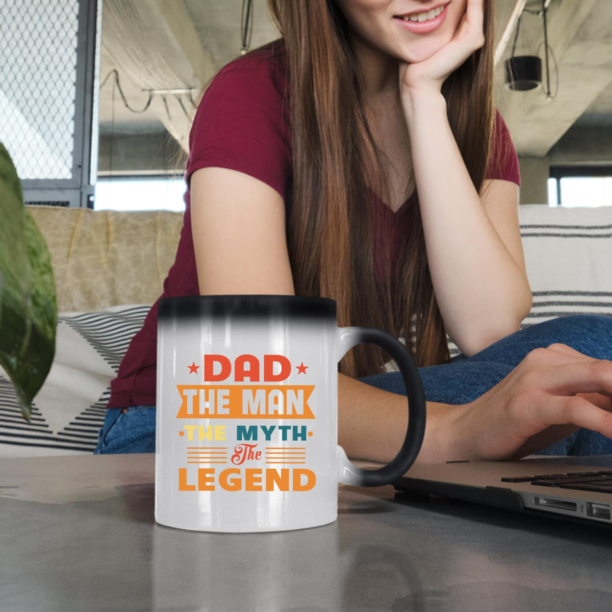 Woman at a laptop with the Dad the Man retro colour changing mug