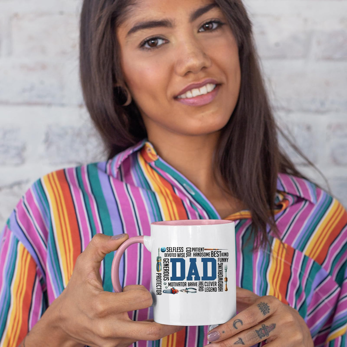 Woman in a striped shirt holding the DAD word cloud colour handle mug