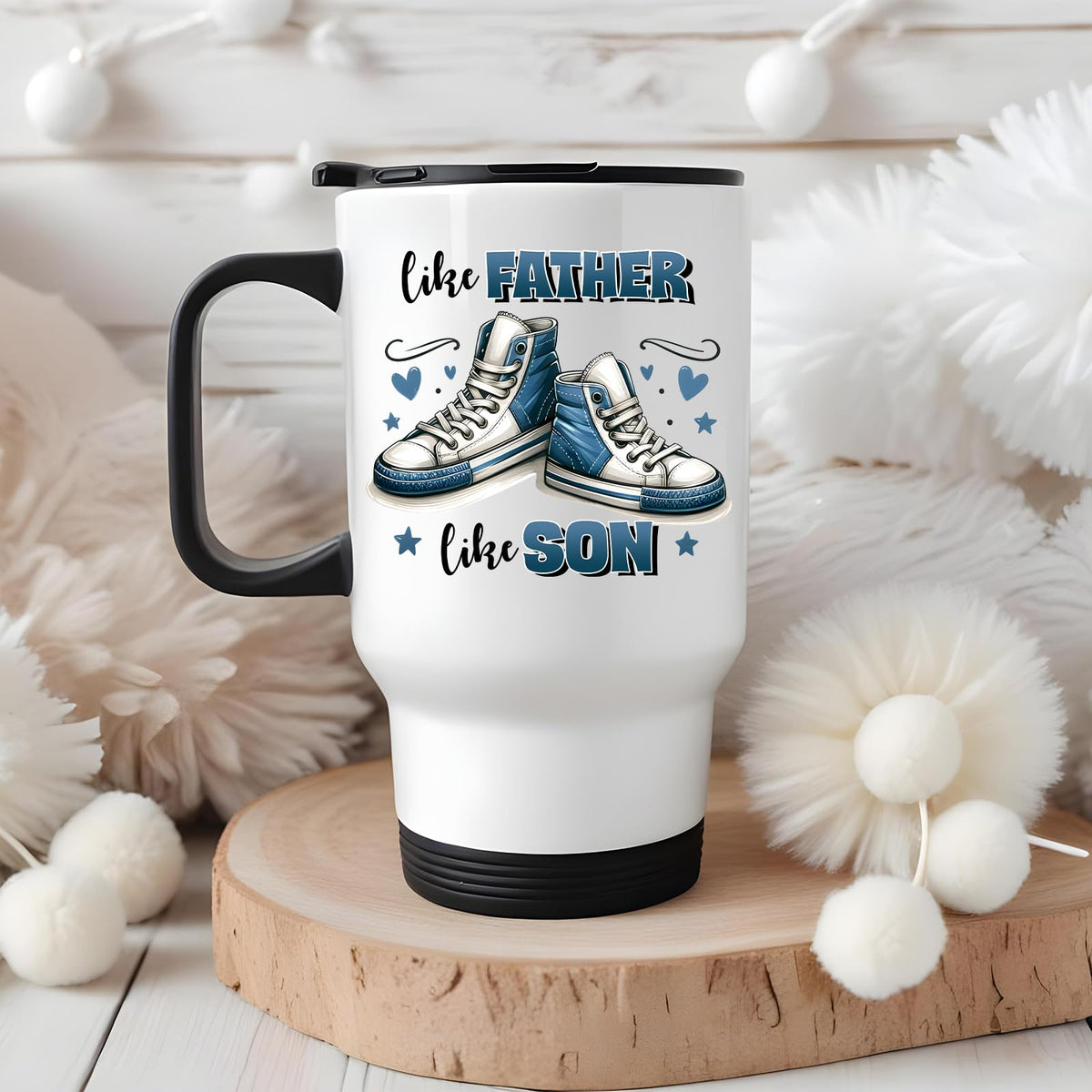 Like Father Like Son travel mug on a wooden slice with white pom-poms