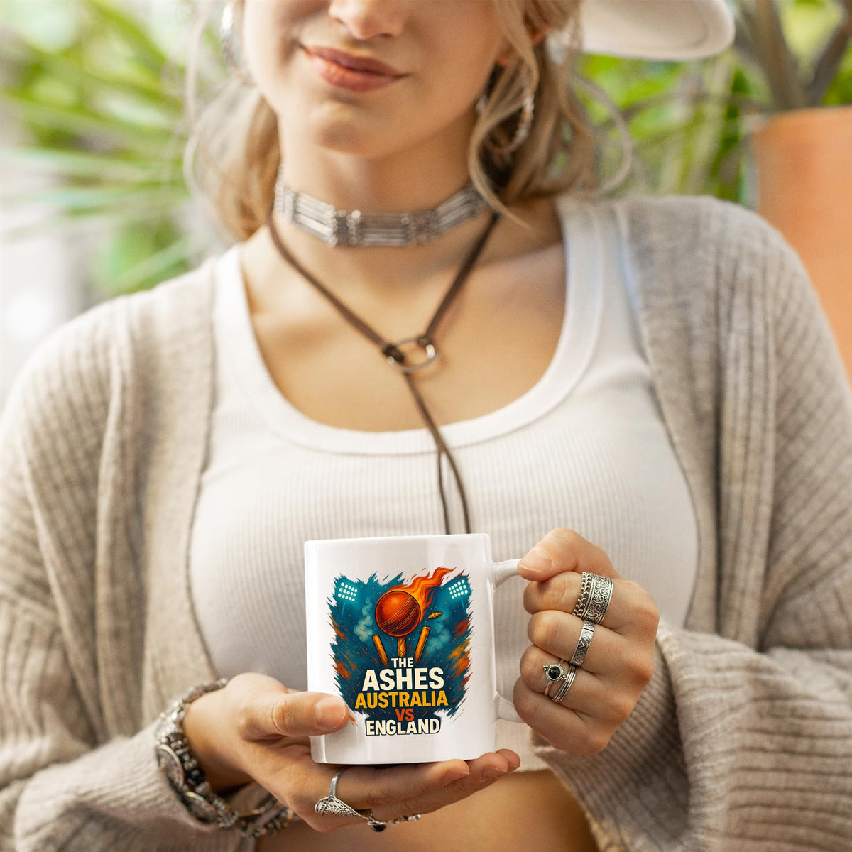 Woman holding the Ashes cricket mug