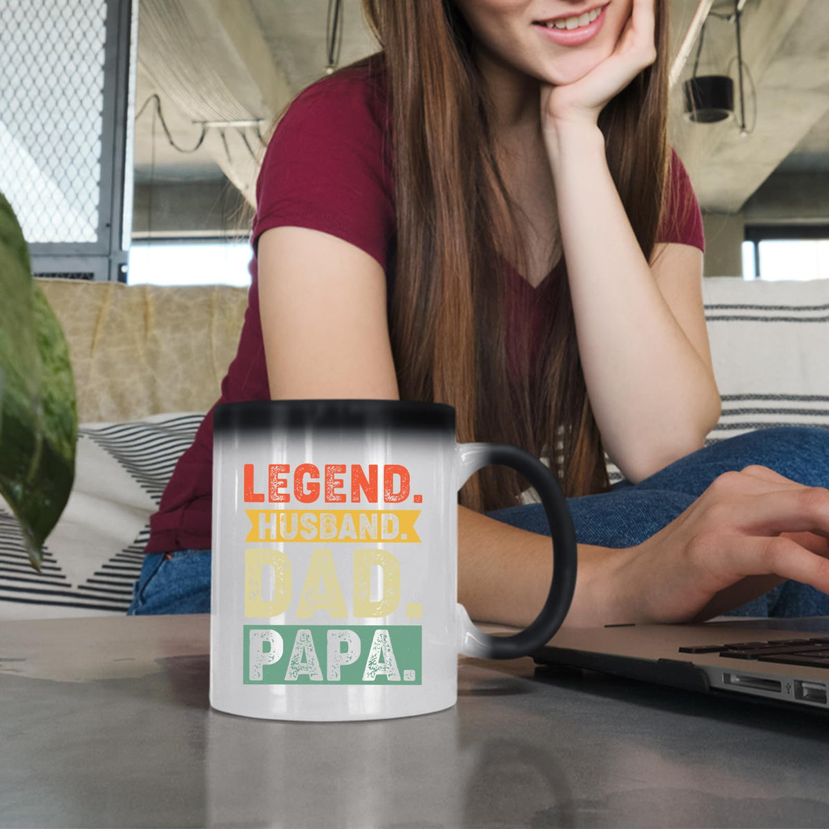 Woman at a laptop with the Legend Husband Dad Papa colour changing mug