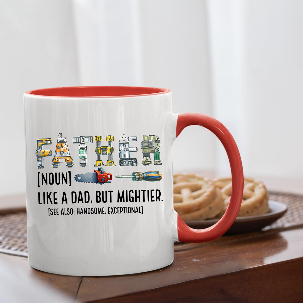 Father definition mug with a red handle beside biscuits