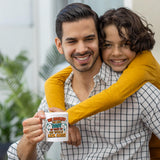 Smiling dad holding the We Hooked the Best Dad mug as his son hugs him