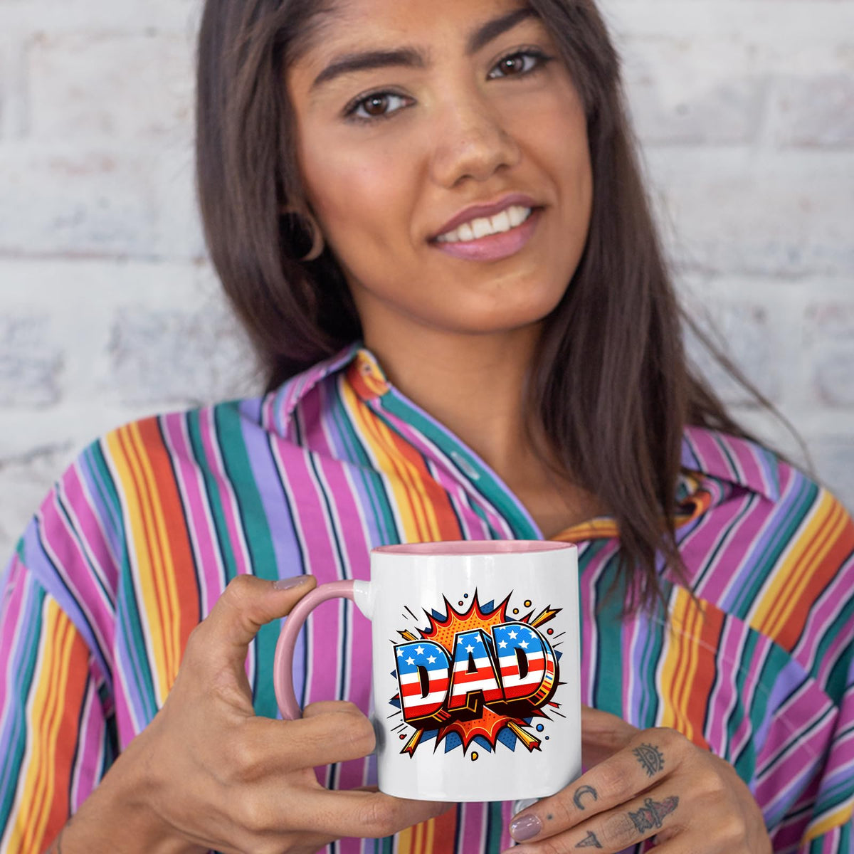 Woman in a striped shirt holding the Stars and Stripes DAD colour handle mug