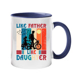 Colour handle mug with a dad and daughter with a bike in silhouette over retro stripes and “Like father, like daughter” – dark blue handle and inside