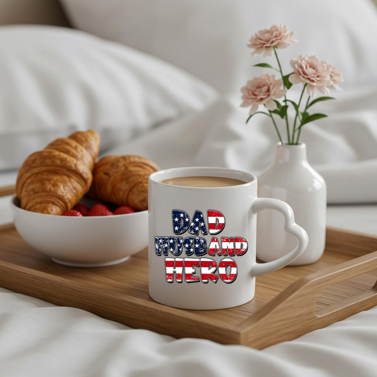 Dad Husband Hero heart-handle mug on a breakfast tray with croissants and flowers