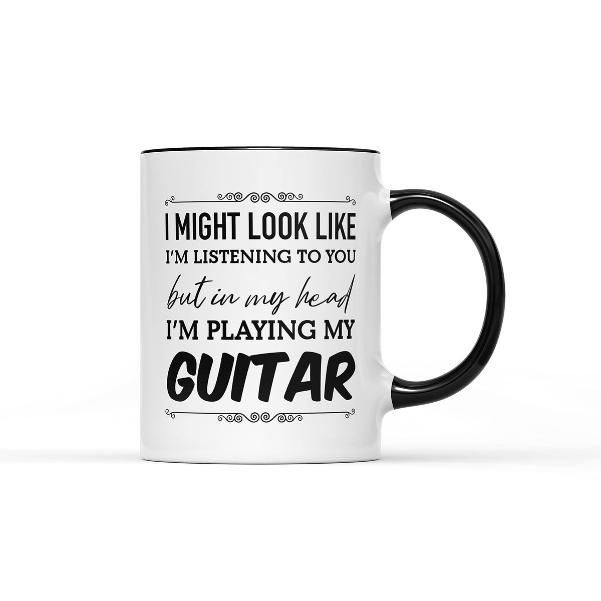 White mug with a black handle and the slogan “I might look like I'm listening to you but in my head I'm playing my guitar”