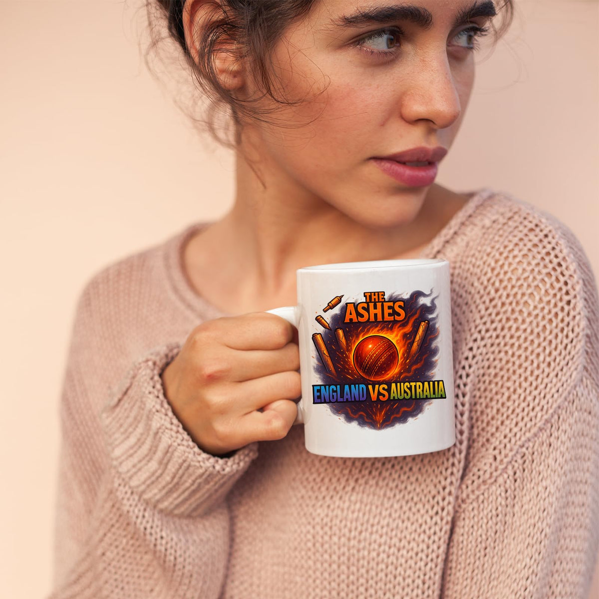 Woman sipping from the Ashes cricket mug