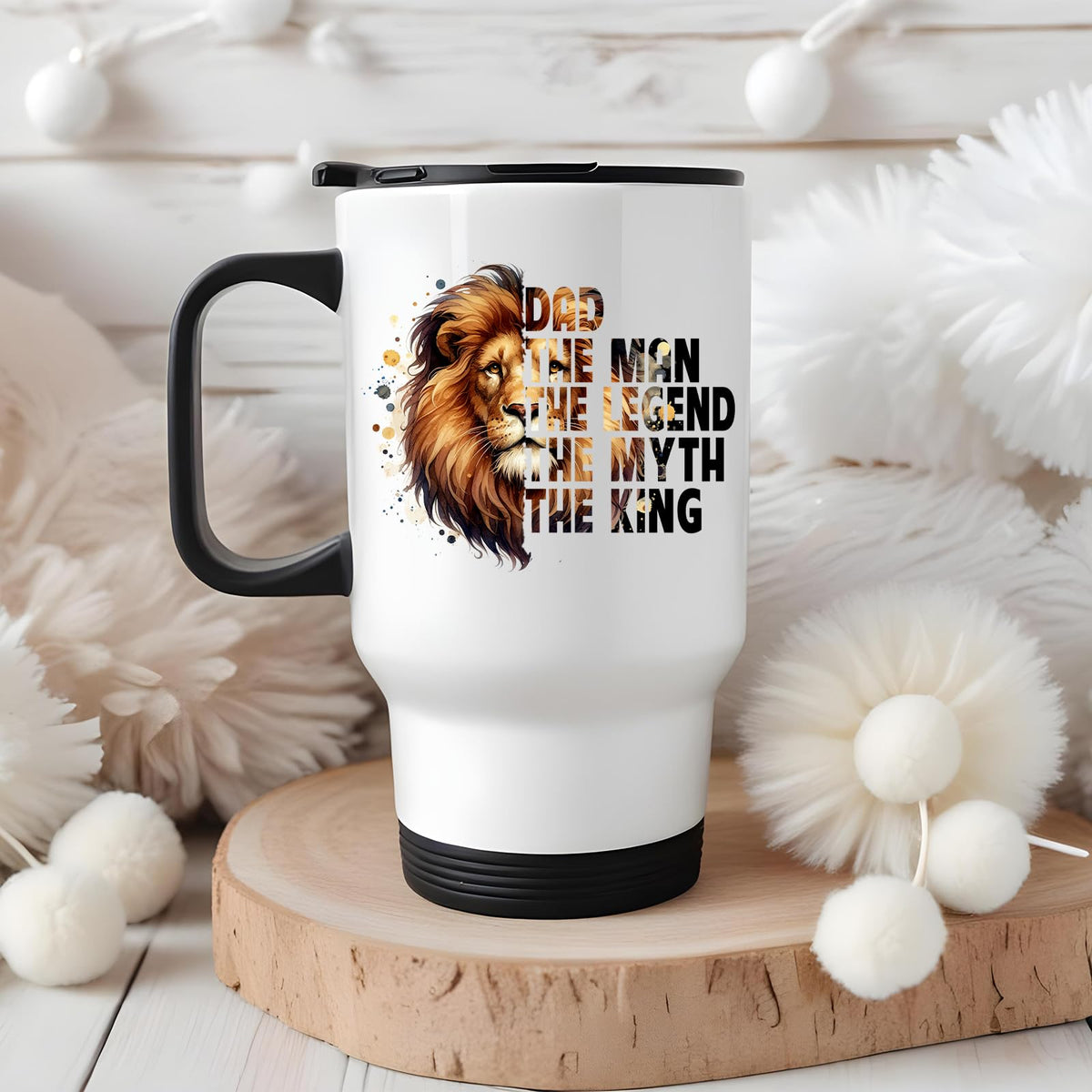 Dad the King lion travel mug on a wooden slice with white pom-poms
