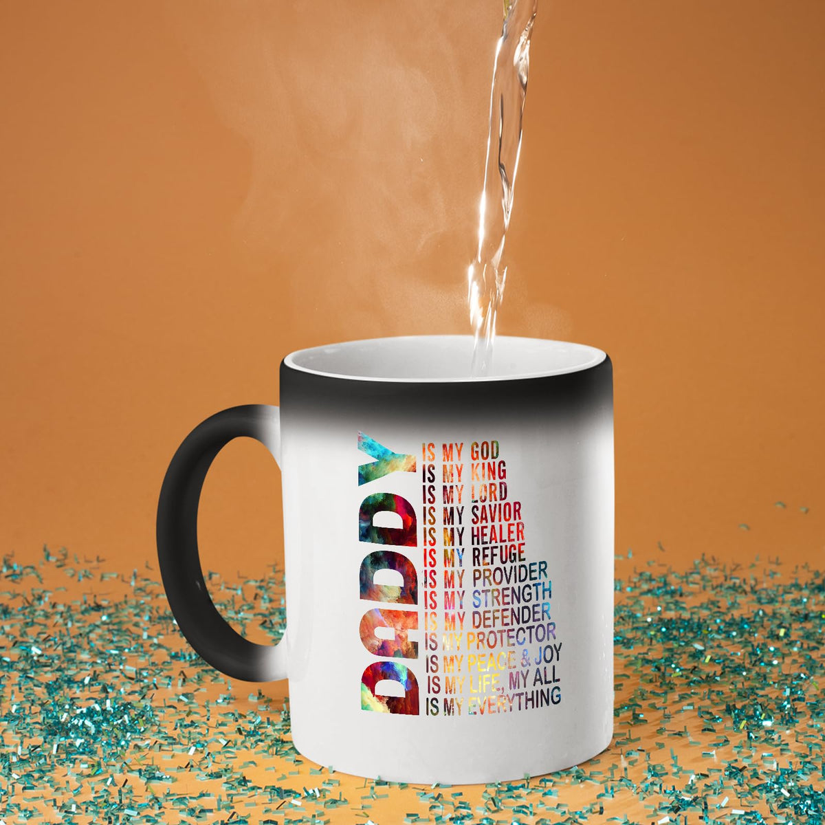 Hot water poured into the Daddy Is My God colour changing mug as the design appears