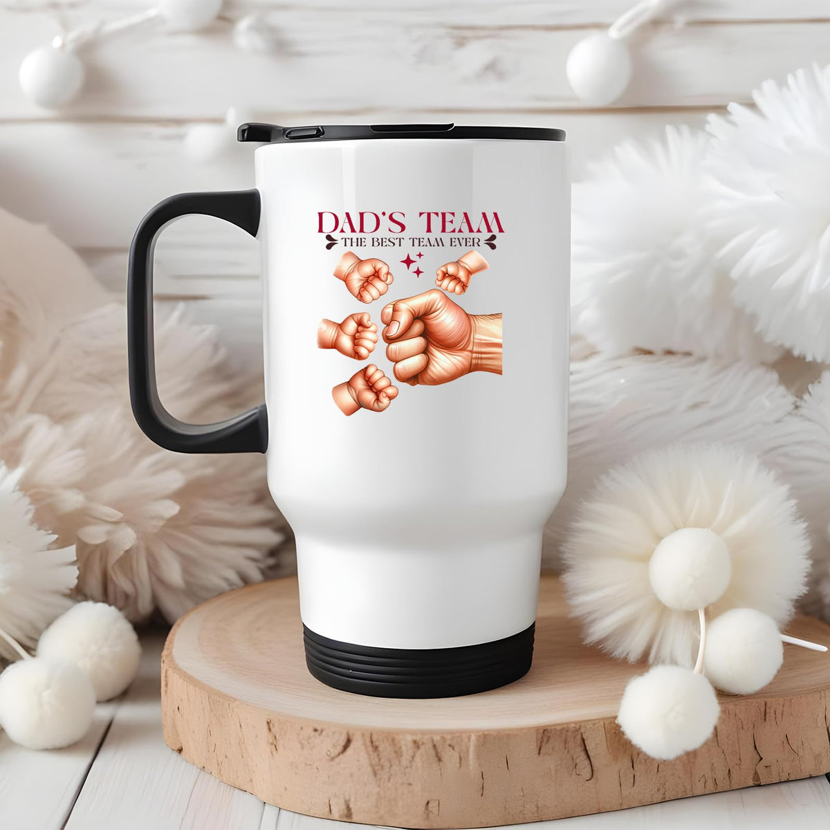 Dad’s Team fist bump travel mug on a wooden slice with white pom-poms