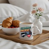 Gaming Mode On heart-handle mug on a breakfast tray with croissants and flowers