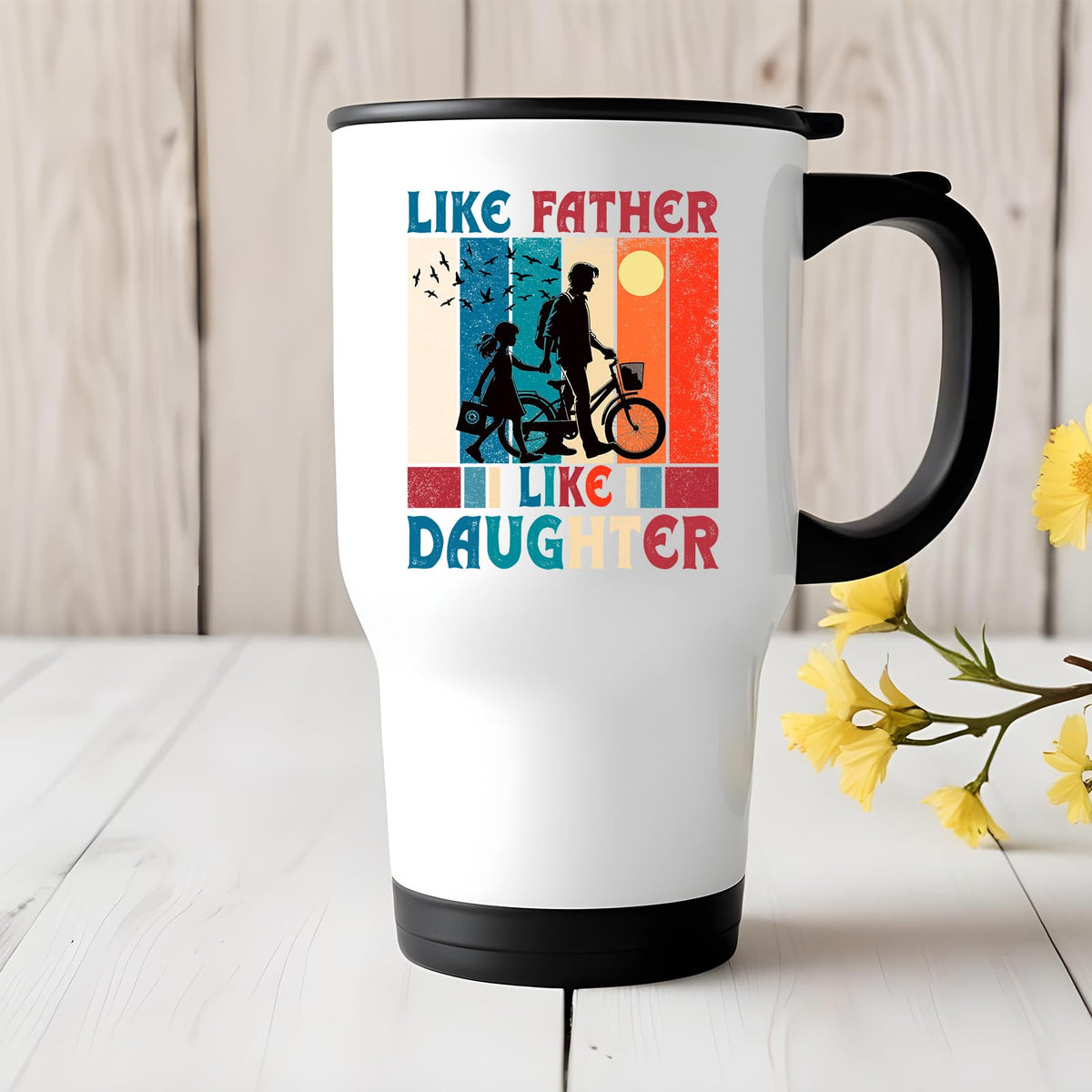 Like Father Like Daughter travel mug on a white wooden table with yellow flowers