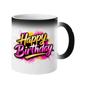 Colour changing mug revealing “Happy” in gold and “Birthday” in pink script on a pink and gold splash