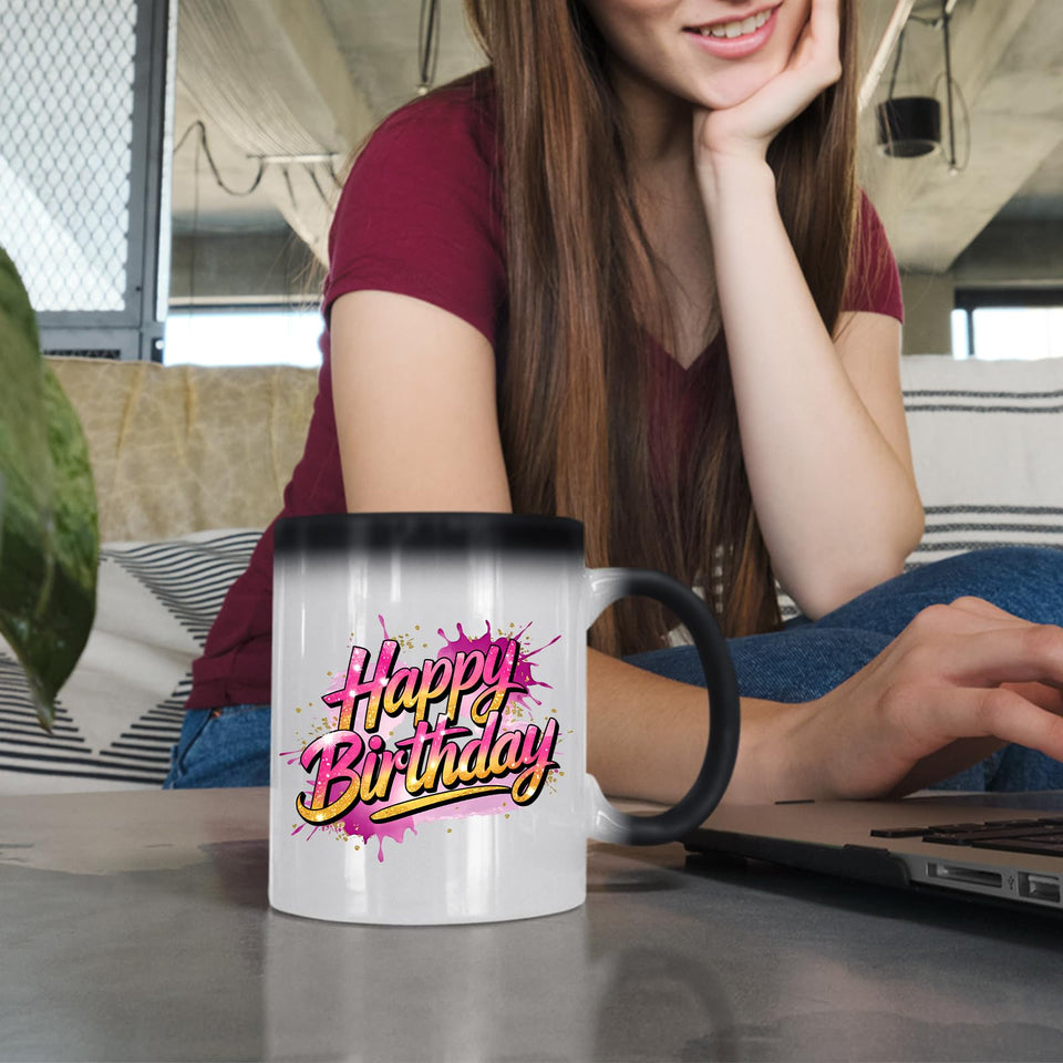 Woman at a laptop with the Happy Birthday pink splash colour changing mug