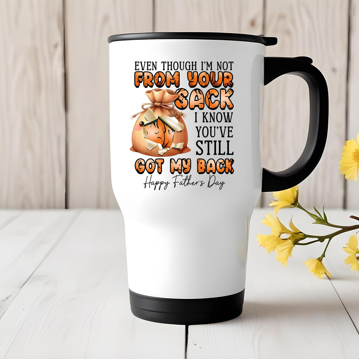 Not From Your Sack travel mug on a white wooden table with yellow flowers
