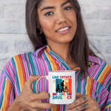 Woman in a striped shirt holding the Like Father Like Daughter colour handle mug