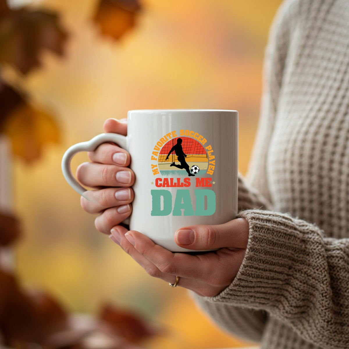 Hands holding the Soccer Dad heart-handle mug