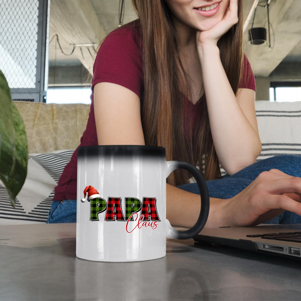 Woman at a laptop with the Papa Claus colour changing mug