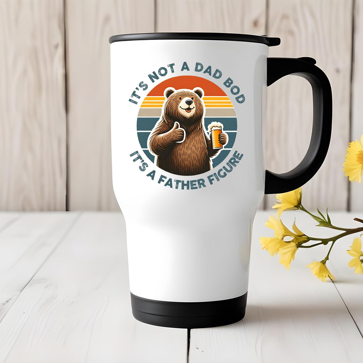 Dad Bod bear travel mug on a white wooden table with yellow flowers