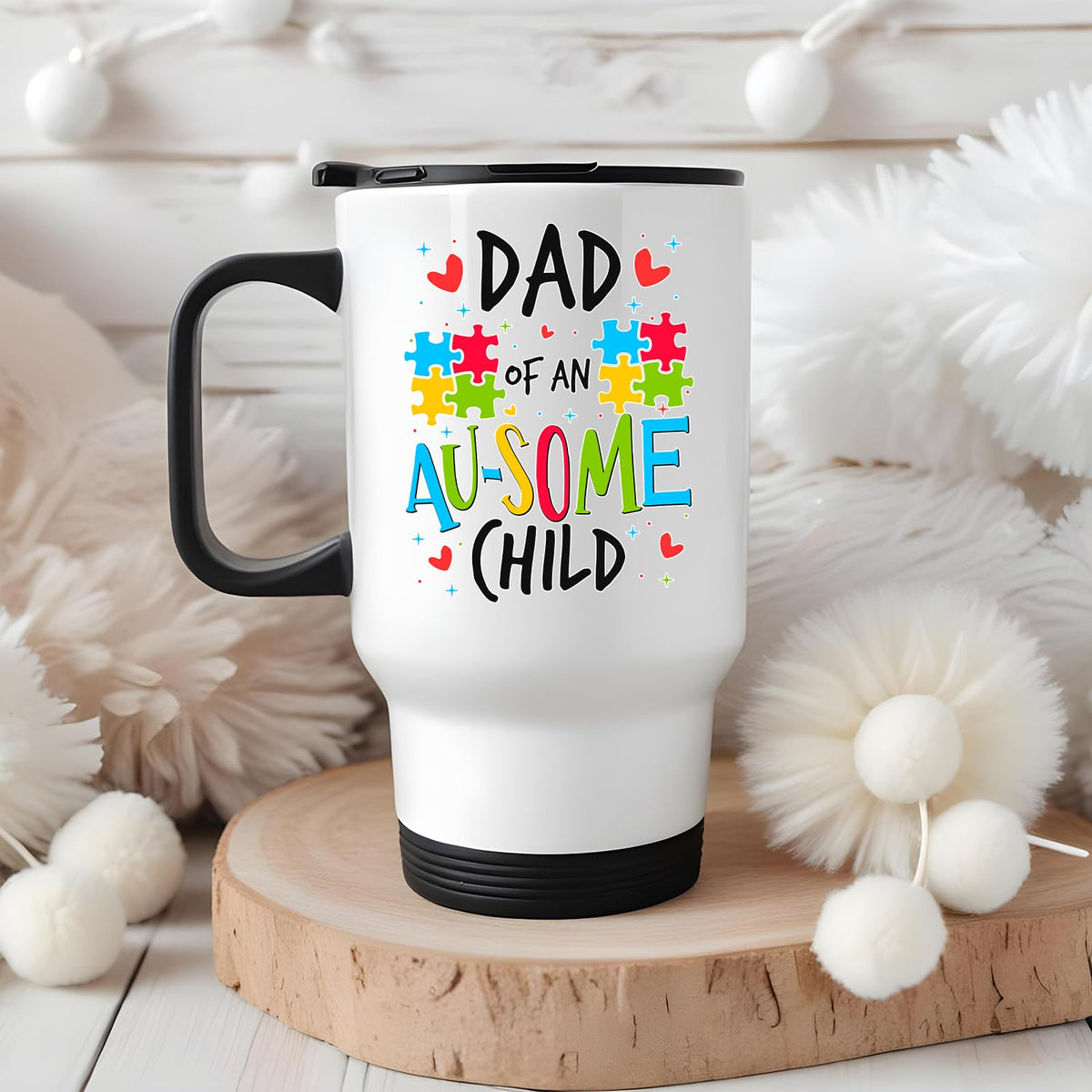 Dad of an Au-Some Child travel mug on a wooden slice with white pom-poms