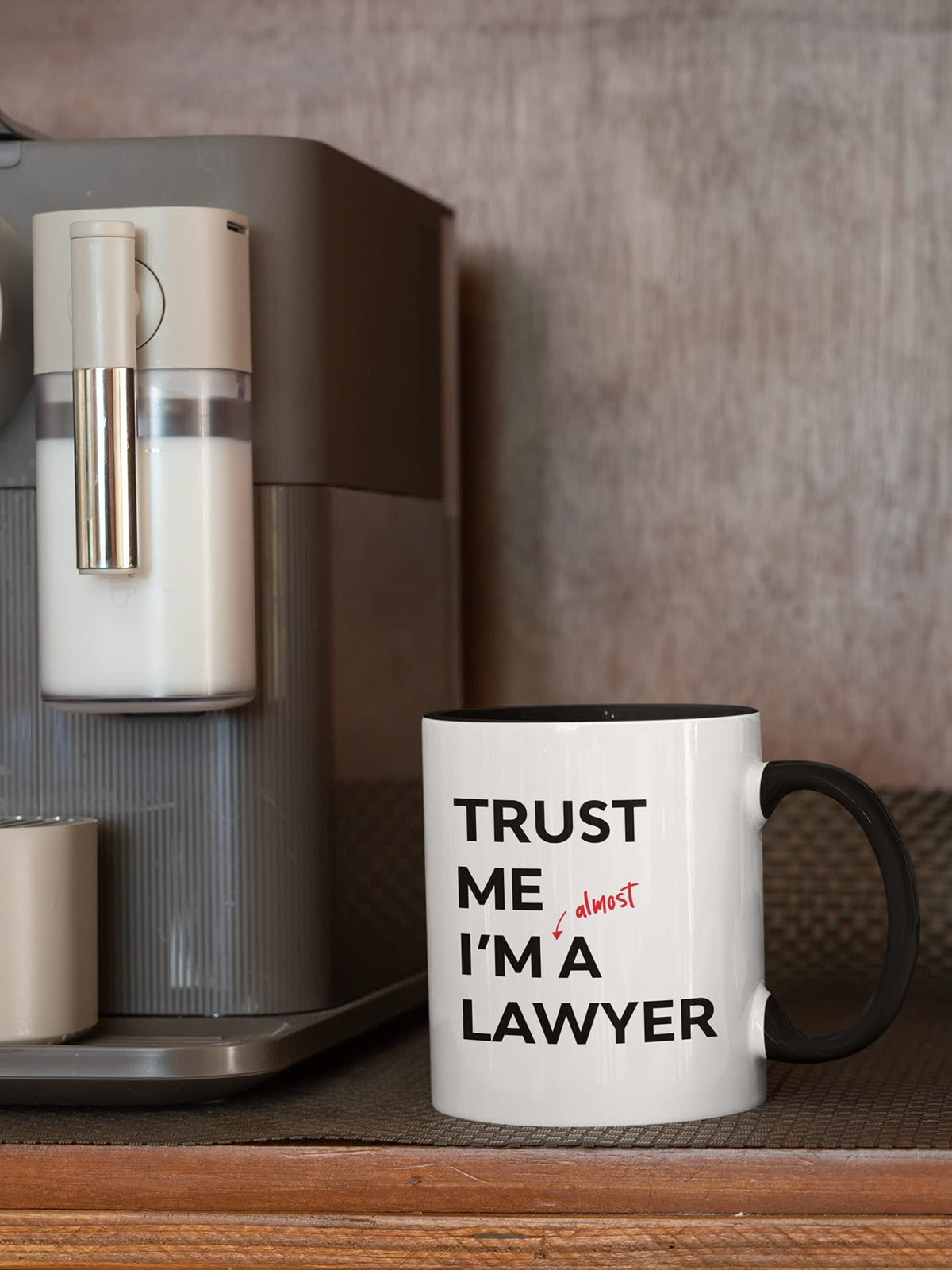 Almost a lawyer mug next to a coffee machine