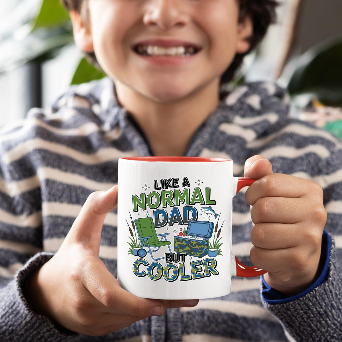 Smiling child holding the Like a Normal Dad But Cooler mug with a red handle