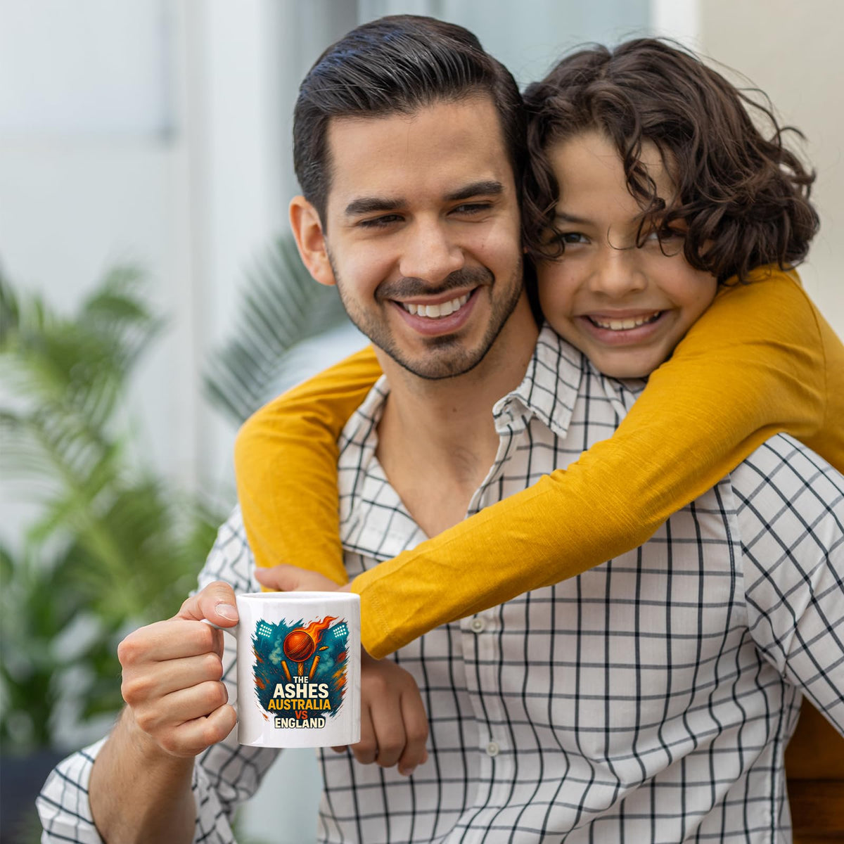 Father and son with the Ashes cricket mug
