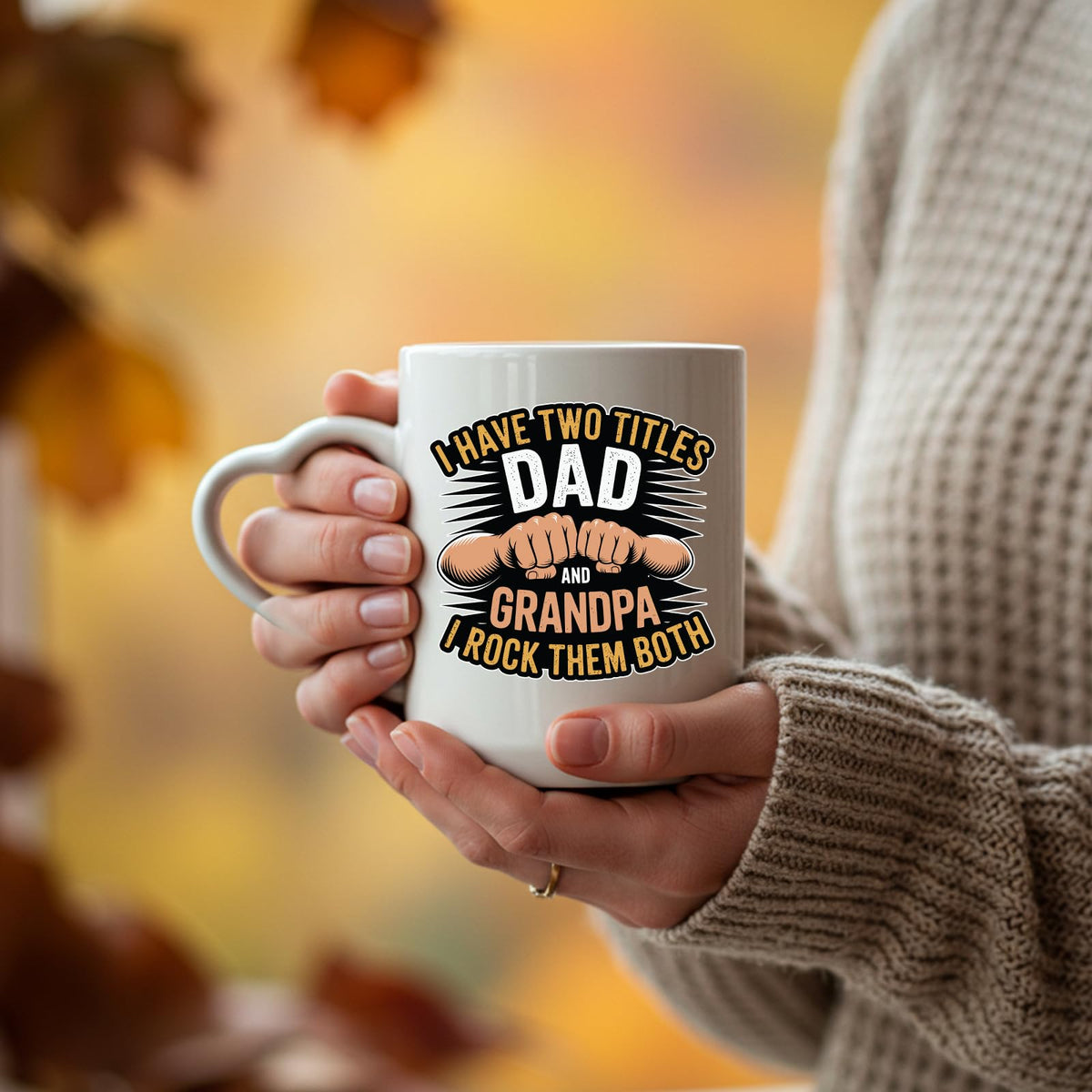 Hands holding the Two Titles Dad and Grandpa heart-handle mug