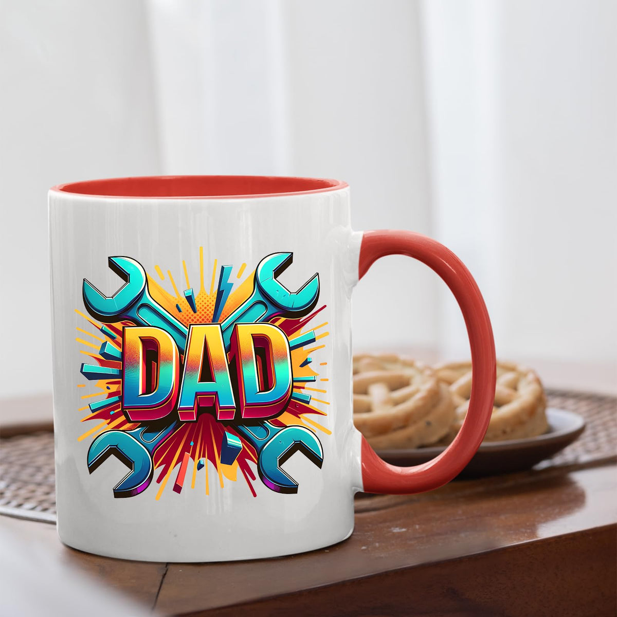 DAD spanners mug with a red handle beside biscuits