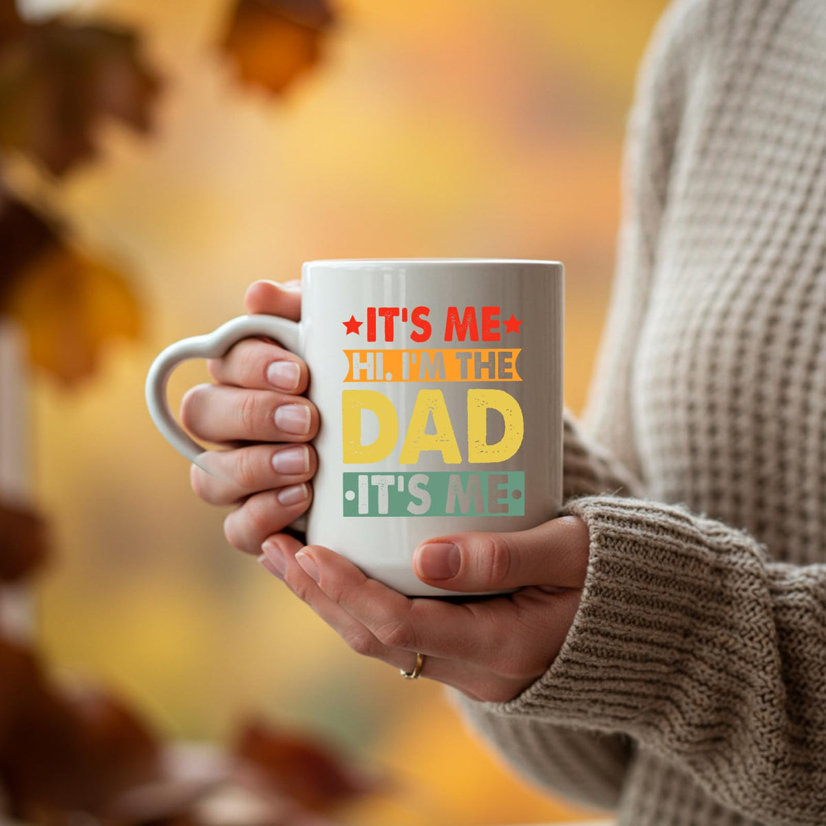 Hands holding the It’s Me Hi I’m the Dad heart-handle mug