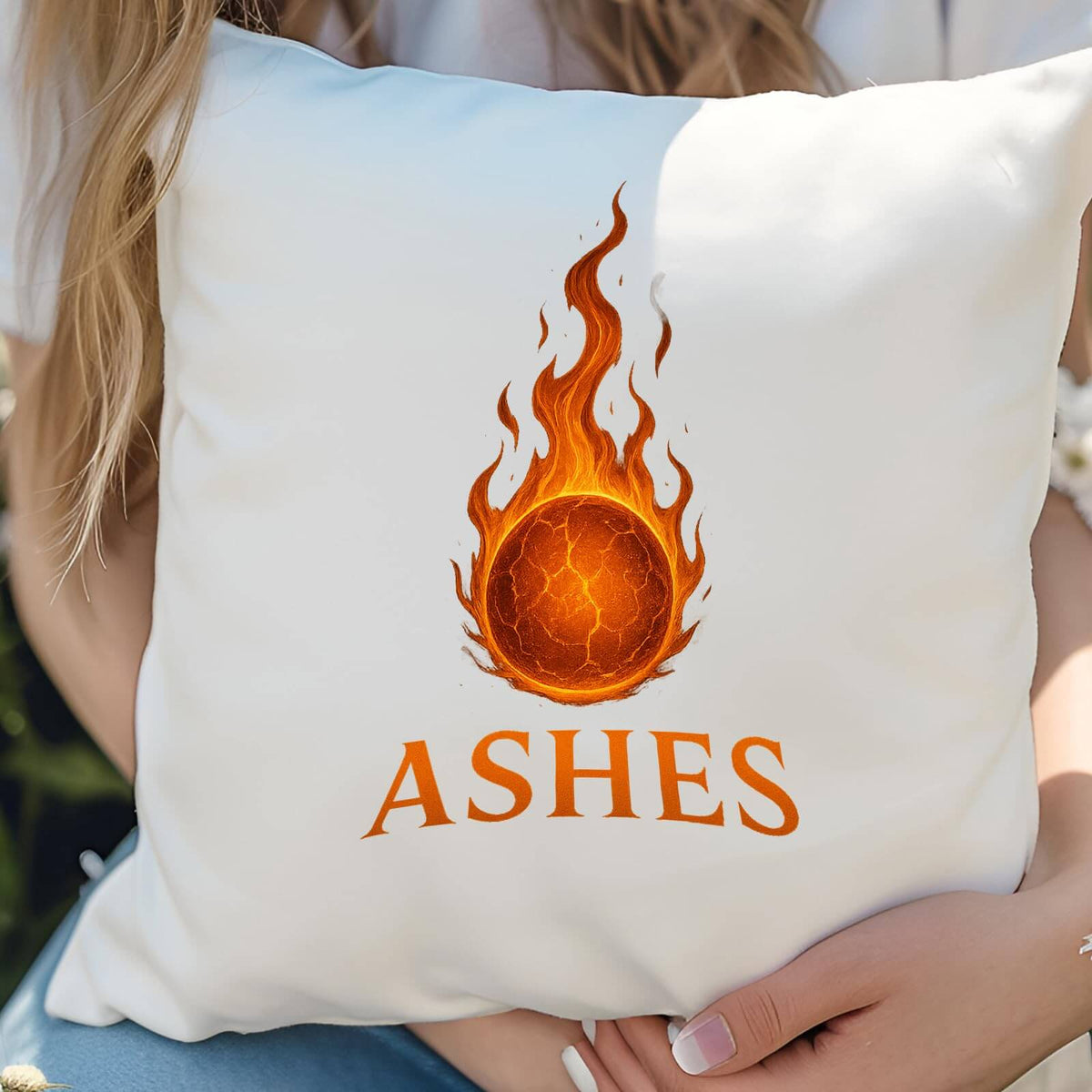 Hands holding the Ashes cricket cushion