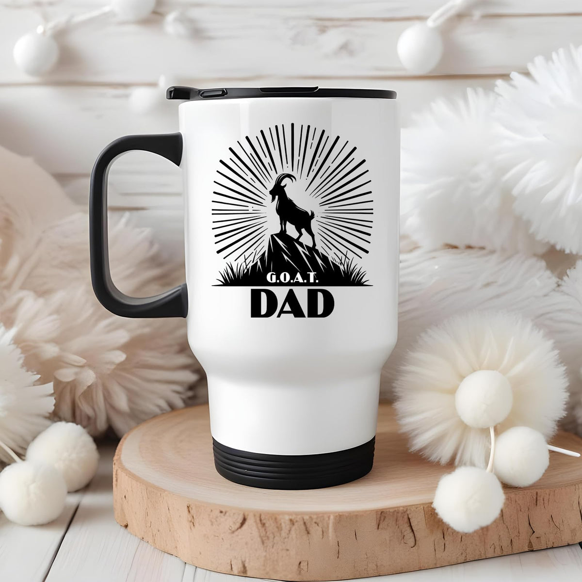 GOAT Dad travel mug on a wooden slice with white pom-poms
