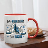Like Father Like Son mug with a red handle beside biscuits