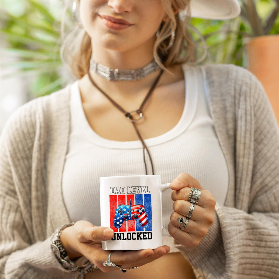 Woman in a cardigan holding the Dad Level Unlocked mug