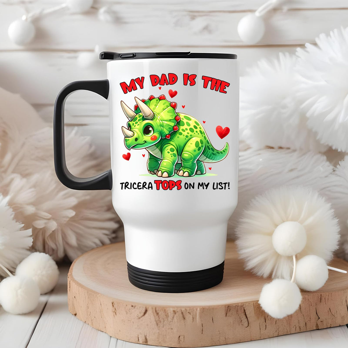 Triceratops dad travel mug on a wooden slice with white pom-poms