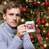 Man holding the Daddy’s Valentine mug in front of a Christmas tree