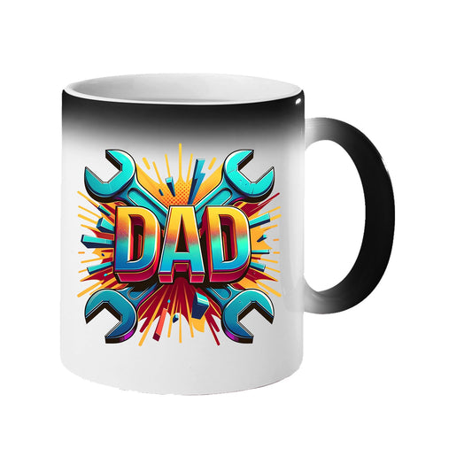 Colour changing mug revealing a comic-style “DAD” on a burst of crossed spanners